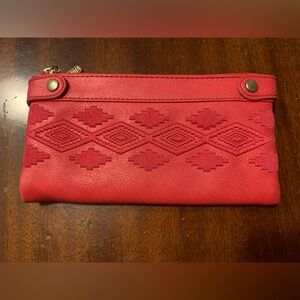 Roots bright pink wallet.